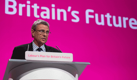 Dave Prentis speaking at the rostrum at Labour Party conference 2014
