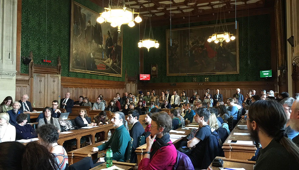 Photo of a full committee room in the Houses of Parliament as UNISON members and others who are citizens of other EU countries lobby their MPs