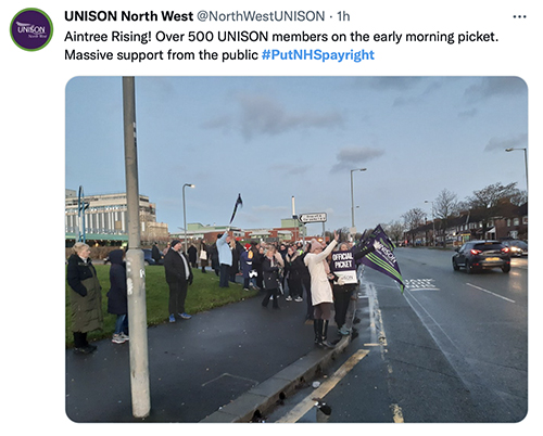 Screengrab of a text from UNISON North West, featuring a picture of a picket line and supporters in Aintree