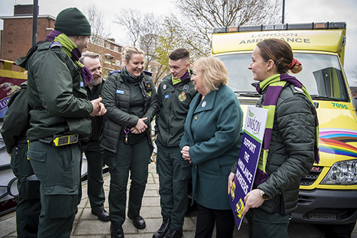 Christina McAnea with striking members at Waterloo and an ambulance